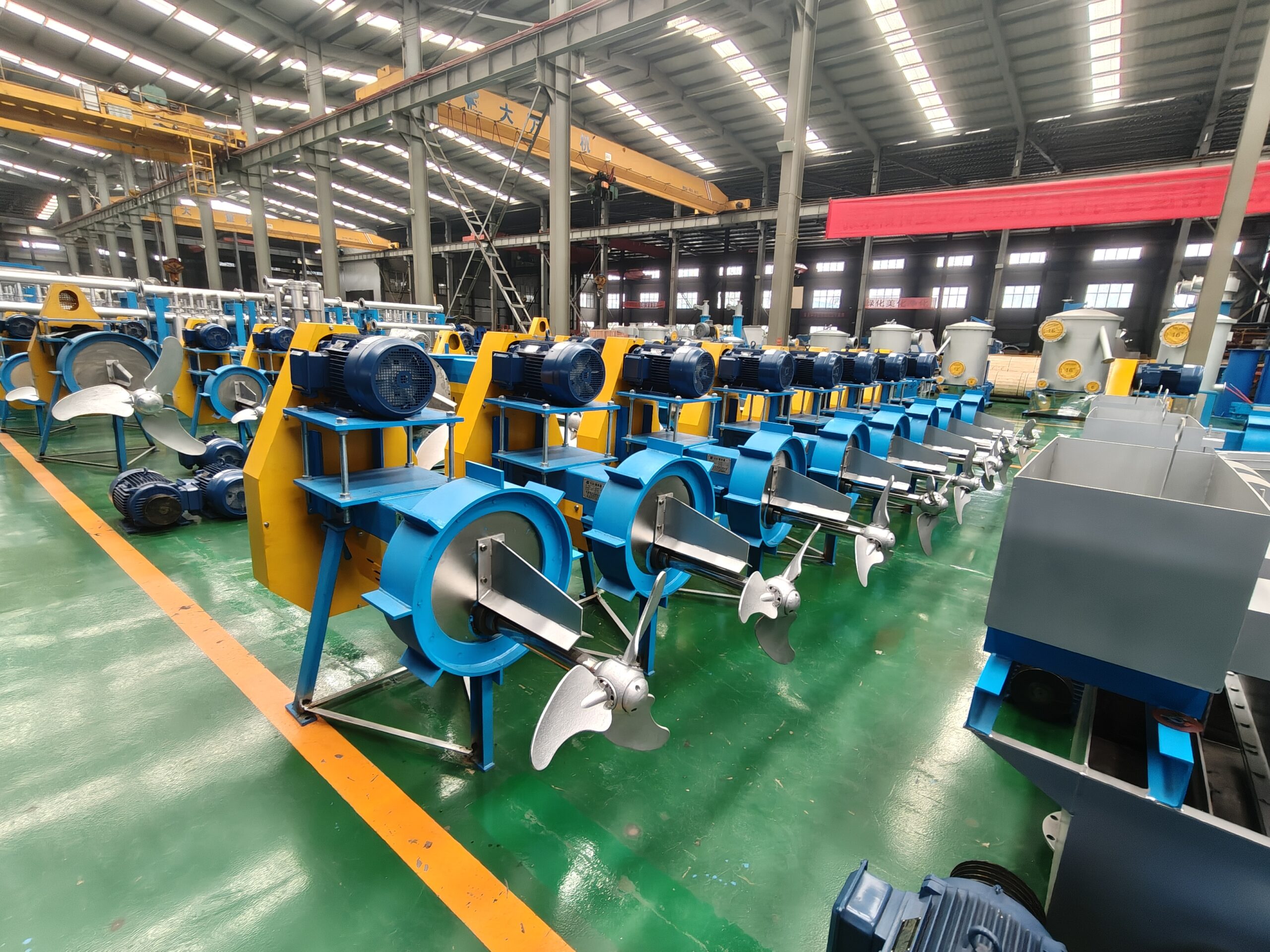 Zejiang chest (top-entry) propeller agitators lined up in the factory workshop