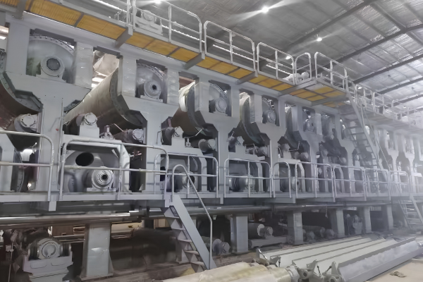Welding and machining a replacement roll assembly for a paper machine rebuild