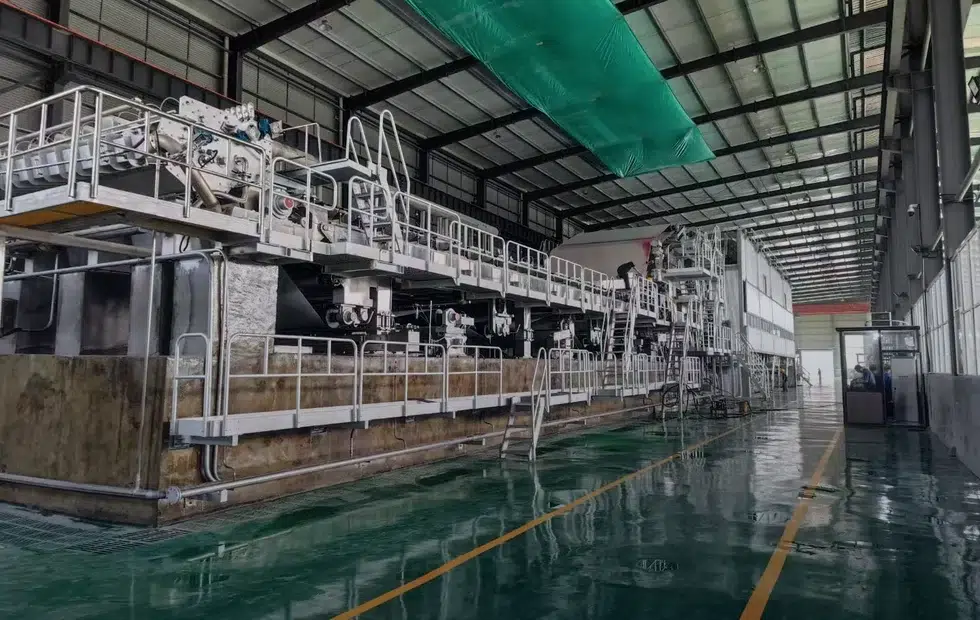 Factory acceptance tested paper machine configured to customer grade width and furnish