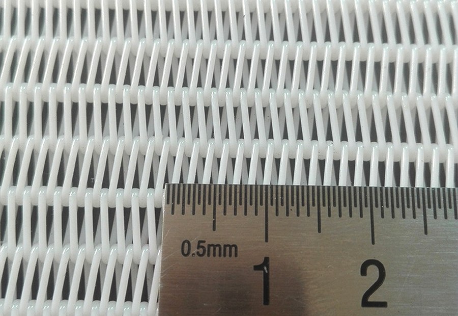 Dryer fabric open weave close-up showing permeability for heated dryer sections
