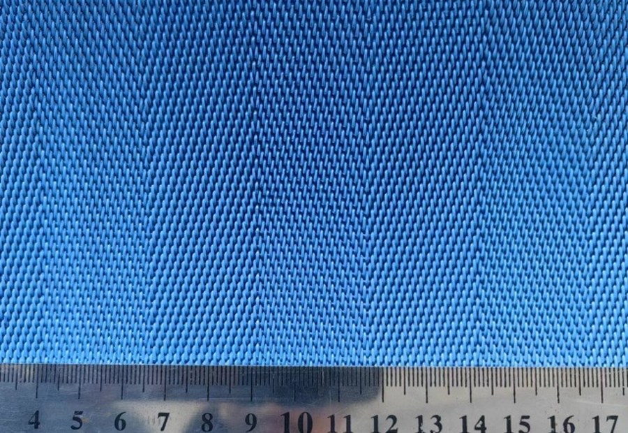 Close-up forming fabric mesh with measuring scale for drainage and sheet support selection